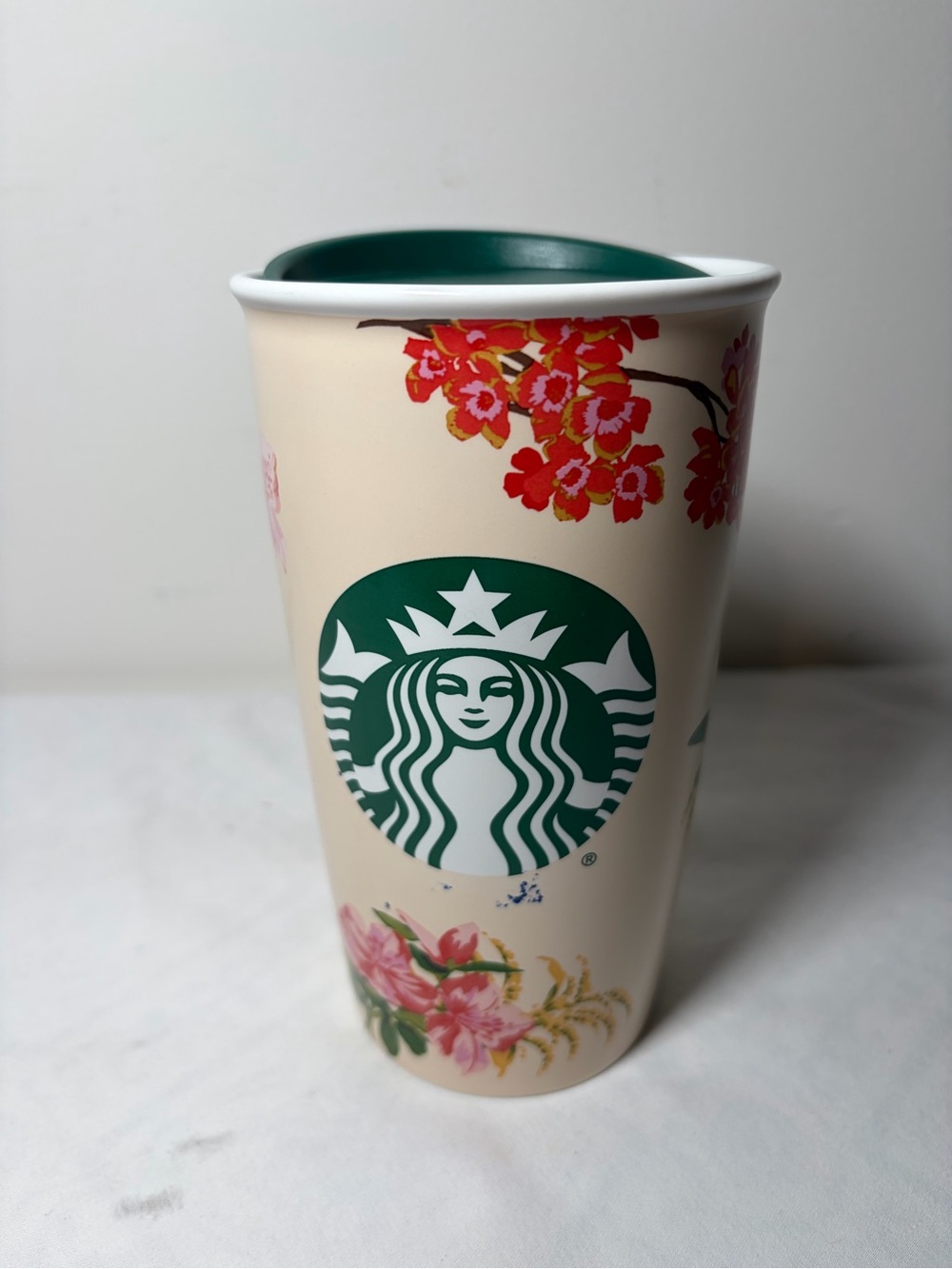 Starbucks Cream Tumbler with Green Logo and Floral Accents
